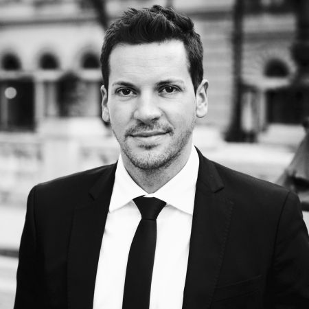 Milan a lawyer wearing a suit and tie